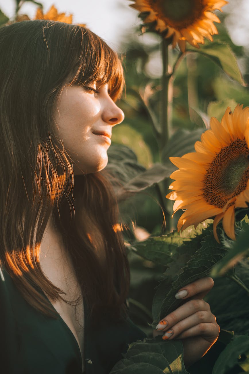peaceful woman enjoying sun and nature